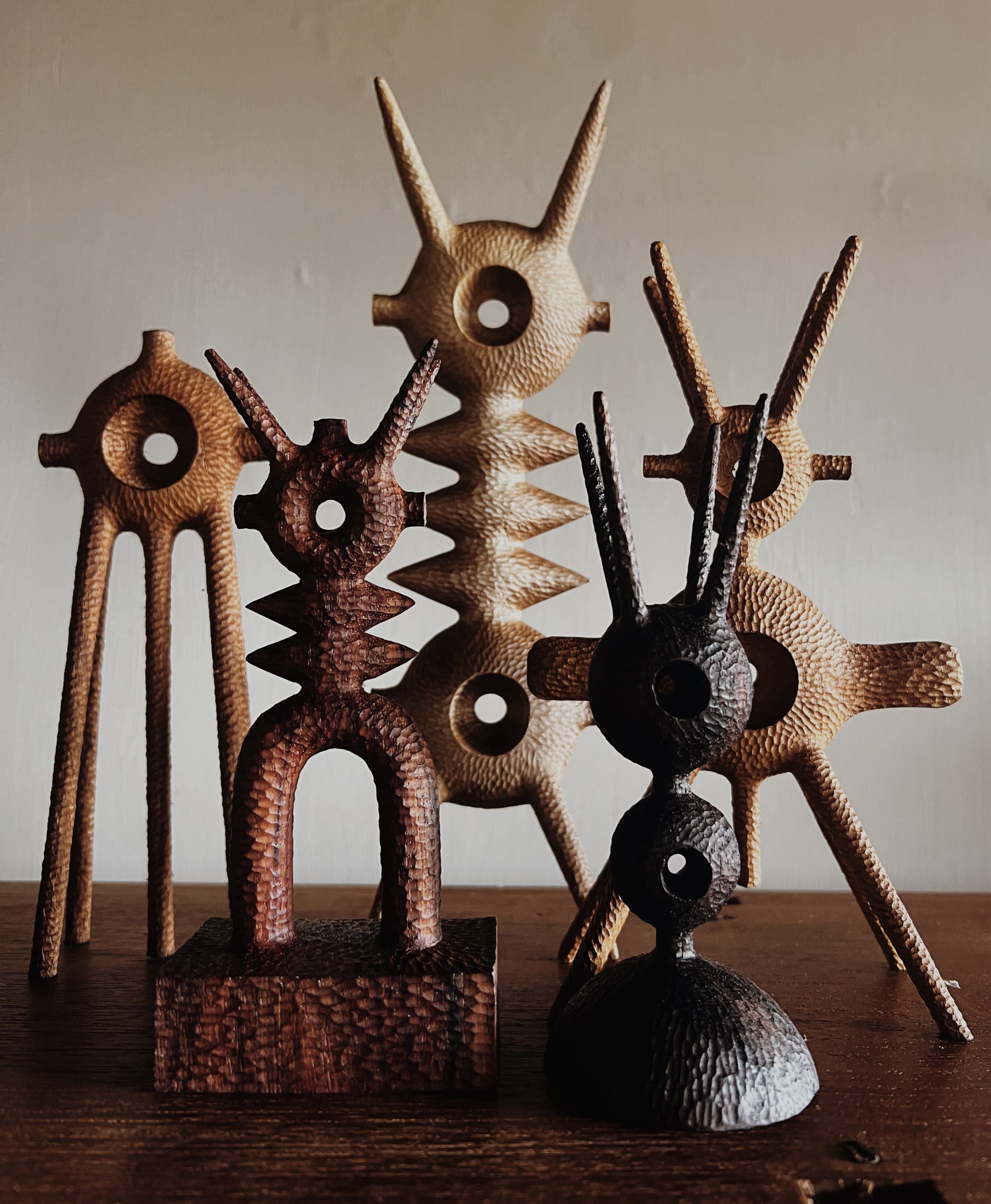 Retrofuturistic Figures Emerge from Wood in Playful Sculptures by Aleph Geddis